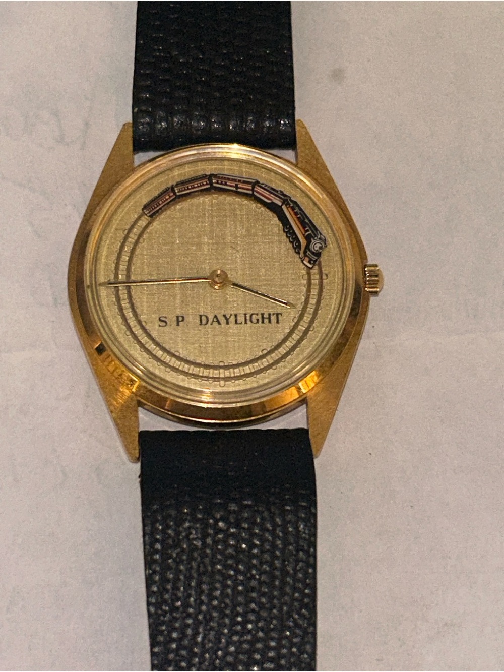 S.P. Daylight Men's Gold Watch w Moving Train Black Leather Strap. New battery